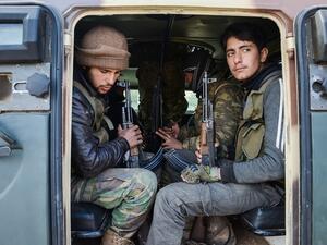 Rebel fighters near the town of Bizaah, northeast of the city of al-Bab on 4 February. (AFP/File)