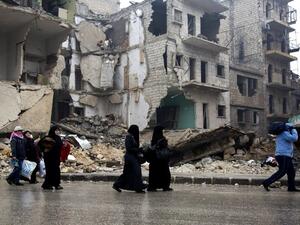 Syrians leave a rebel-held area of Aleppo towards the government-held side on December 13, 2016 during an operation by Syrian government forces to retake the embattled city. (AFP/Karam al-Masri)