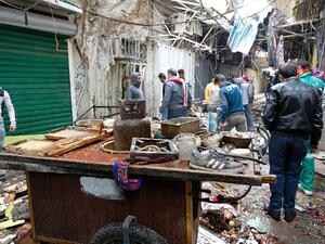 Two suicide bombers attacked Baghdad's central Al-Sinek neighbourhood killing at least 27 people and wounding 53. (AFP/SABAH ARAR)

