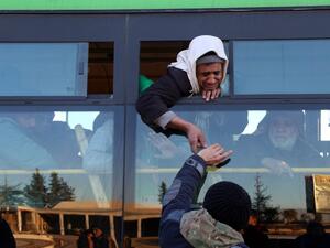 Syrians, who were evacuated from rebel-held neighborhoods in the embattled city of Aleppo, arrive in the opposition-controlled Khan al-Aassal region, west of the city, on December 15, 2016. (AFP/Baraa al-Halabi)