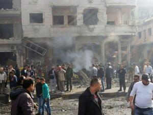 In this photo released by the Syrian official news agency SANA, residents gather at the scene where two blasts exploded in the pro-government neighborhood of Zahraa, in Homs province, Syria, Sunday, Feb. 21, 2016. (AFP/File)