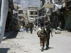 Members of the Syrian Democratic Forces (SDF) patrol a street in the northern Syrian town of Manbij on August 7, 2016, as they comb the city in search of the last remaining militants, a day after they retook it from Daesh. (AFP/Delil Souleiman)