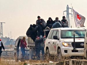 Syrians are evacuated from a rebel-held area of Aleppo towards rebel-held territory in the west of Aleppo's province on December 16, 2016. (AFP/Stringer)