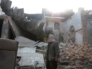 Syrian Abu Khaled stands amid the rubble of his destroyed house in the rebel-held town of Douma, on the eastern outskirts of Damascus, on December 30, 2016, on the first day of a nationwide truce. (AFP/Abd Doumany)