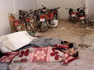 Bodies of those killed during a chemical attack in Syria's Idlib province lie in a storage room in a hospital in Khan Sheikhoun, 4 April 2017. (AFP/Omar Haj Kadour)