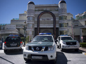 Spanish police vehicles outside one of the properties seized from the uncle of Syrian President Bashar al-Assad. 