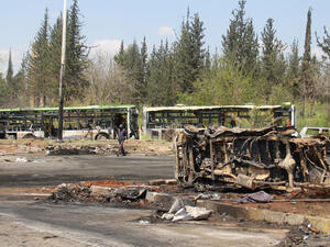 The wreckage of buses targeted by a car bomb in Aleppo, Syria, killing at least 112. (AFP/Omar Haj Kadour) 