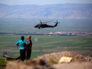 A medical helicopter from the US-led coalition flies near the Syrian Kurdish town of Derik, April 25 2017. (AFP/Delil Souleiman)