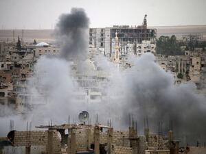 Smoke rises from buildings in a rebel-held neighbourhood of Daraa in southern Syria. (AFP/ File)
