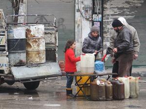 View photos
Residents buy petrol on a street in the northwestern Syrian city of Idlib on December 30, 2016 as a truce brokered by Russia and Turkey came into effect. (AFP/Omar haj kadour)