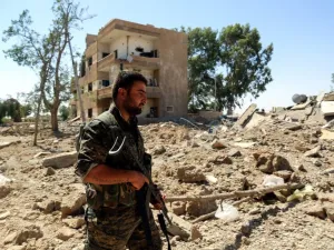 An SDF fighter in war-torn Raqqa, July 2017 (AFP)
