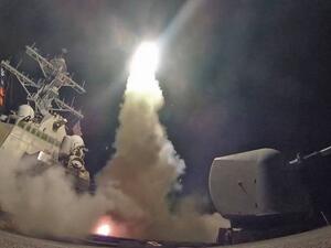The guided-missile destroyer USS Porter conducts a strike against a Syrian airfield from the Mediterranean Sea on Friday. | AFP