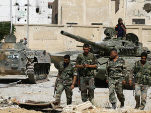 Syrian regime forces, in control of southern city of Daraa, are moving towards the Israeli-occupied Golan Heights. (AFP/ File Photo)