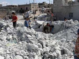 Syrians check a damaged house, reportedly hit by US-led coalition air strikes. (AFP/Sami Ali) 