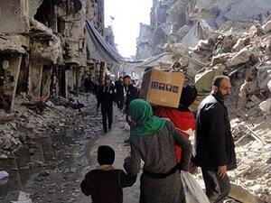 Residents of Syria's besieged Yarmouk refugee camp. (UNRWA/AFP)