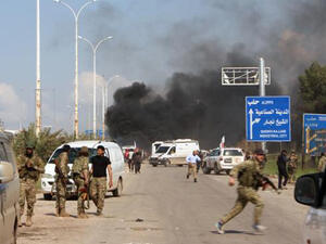 Smoke billowing following a suicide car bombing in Rashidin, west of Aleppo, that targeted buses carrying Syrians evacuated from two besieged government-held towns of Fuaa and Kafraya. (AFP)
