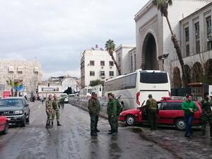 Syrian security forces cordon off the area following a reported suicide bombing at the old palace of justice building in Damascus on March 15, 2017. (AFP/Stringer)