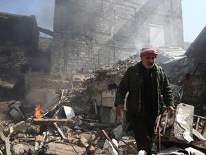 A Syrian man inspects the damage following reported government airstrike on the rebel-held town of Douma, on the eastern outskirts of the capital Damascus, on February 26, 2017. (AFP/Abd Doumany)