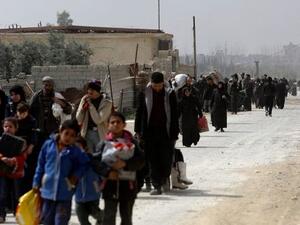 Fleeing refugees from Eastern Ghouta. At least 130,000 have left the suburb as regime forces spread their control on the area, (AFP/ File Photo)