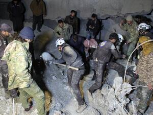 Syrian civil defense volunteers, known as the White Helmets, dig through the rubble of a mosque following an airstrike on a mosque in the village of Al-Jineh near Aleppo late on March 16, 2017. (AFP/Omar Haj Kadour)