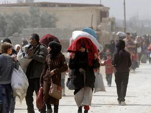Syrian Rebels, Families Begin Evacuation from Eastern Ghouta. (AFP/ File Photo)
