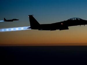Two US Air Force F-15 jets fly over northern Iraq after conducting airstrikes in Syria on September 23, 2014. (AFP)