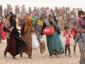Syrian refugees stranded at the Hadalat border crossing, closed by Jordan after a recent attack on border guards. (AFP/File)