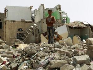 A Yemeni child walks through the rubble of a building hit by a Saudi airstrike. (AFP/File)