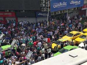 Iranian protesters outside a mobile phone shop in Tehran on 25 June 2018. (AFP/ File)