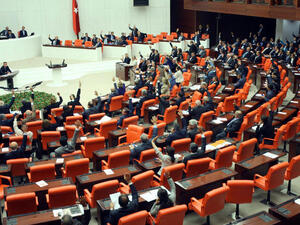 Turkish deputies convene on October 3, 2013 at the Parliament in Ankara to discuss a motion to the parliament asking for authorization to send troops to Syria. (Image credit: AFP)