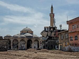 Damaged houses and a mosque are pictured in the historical district in Diyarbakir, southeastern Turkey, on May 5, 2016, following clashes between Turkish forces and Kurdish militants. (AFP/Ilyas Akengin)