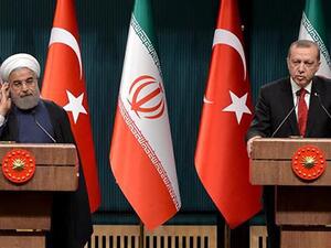 Turkish President Recep Tayyip Erdogan (R) speaks during a joint press conference with his Iranian counterpart Hassan Rouhani in Ankara. (AFP/ File)