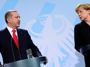 Turkish President Recep Tayyip Erdogan and German Chancellor Angela Merkel (AFP)