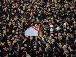 People carry the coffin of Yunus Gormek, 23, one of the victims of the Reina night club attack, during his funeral ceremony on January 2, 2017 in Istanbul. (AFP/Bulent Kilic)