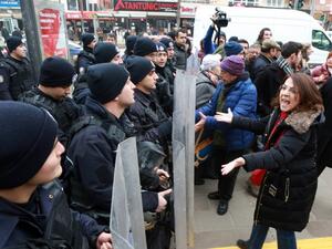 University students and academics face Turkish riot policemen during a protest outside a university campus in Ankara on February 10, 2017, against the dismissal of academics from universities following a post-coup emergency decree. (AFP/Adem Altan)