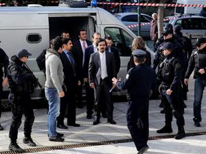 Turkish officers are escorted by Greek special police forces as they arrive at the Greek Supreme Court in Athens, for a hearing concerning a possible extradition of the officers over July's failed coup in Turkey, on January 23, 2017. (AFP/Angelos Tzortzinis)