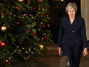Britain's Prime Minister Theresa May makes a statement outside 10 Downing Street in central London after winning a confidence vote on December 12, 2018. (Oli SCARFF / AFP)