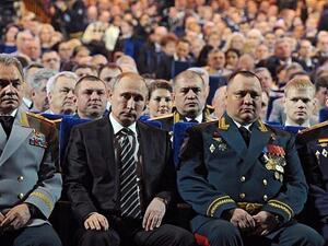 ussia's Minister of Defense Sergei Shoigu, left, and Russia's President Vladimir Putin, 2nd left, attend a gala at the State Kremlin Palace in Moscow. (AFP / MIKHAIL KLIMENTYEV)