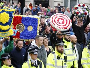 Thousands of football fans have gathered in London to protest extremism - alongside the founder of far-right racist organization the English Defence League (EDL) (AFP)