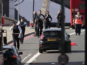 Members of the Police and Ambulance service assess the scene on London Bridge in London on June 4, 2017, following a terror attack. (Daniel Leal-Olivas/AFP)