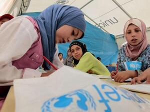 Young Syrian refugees attend a UNICEF-run school at the al-Zaatari refugee camp in the Jordanian city of Mafraq. (AFP/ Khalil Mazraawi)