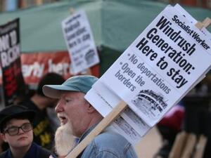 Supporters carry placards at the tail-end of a Windrush generation solidarity protest in Brixton, London on April 20, 2018. (AFP/ File Photo)