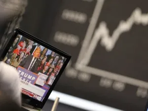 On the currency markets, the dollar tumbled about 2 per cent against major global currencies as Trump supporters celebrated his victory over Democrat candidate Hillary Clinton. (AFP/Daniel Rowland)
