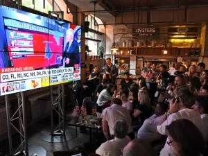 Should there be a Trump win, the sell-offs in global markets will be compounded by the markets having priced in a Clinton victory and were wrong. (AFP/William West)