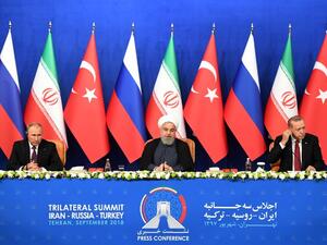 Iranian President Hassan Rouhani (C), Turkish President Recep Tayyip Erdogan (R) and Russian President Vladimir Putin attend a press conference after a trilateral meeting in Tehran on September 7, 2018.(Kirill KUDRYAVTSEV / POOL / AFP)