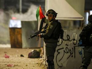 An Israeli border guard stands during clashes with Palestinian protesters in the occupied West Bank city of Ramallah on December 11, 2018. (AFP)