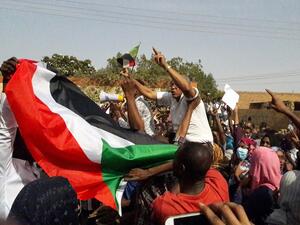 Sudanese protesters wave their national flag and chant slogans during an anti-government demonstration in the capital Khartoum's twin city of Omdurman on January 31, 2019. (AFP)