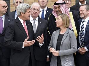 US Secretary of State John Kerry speaks to other conference delegates (Bertrand Guay/Pool/AFP)