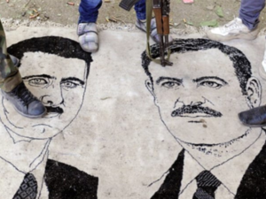 Assad and his late Father /AFP