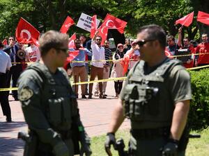 Pro-Erdogan supporters wave Turkish flags during a rally in front of the White House in Washington,DC on May 16, 2017. (AFP/Olivier Douliery)